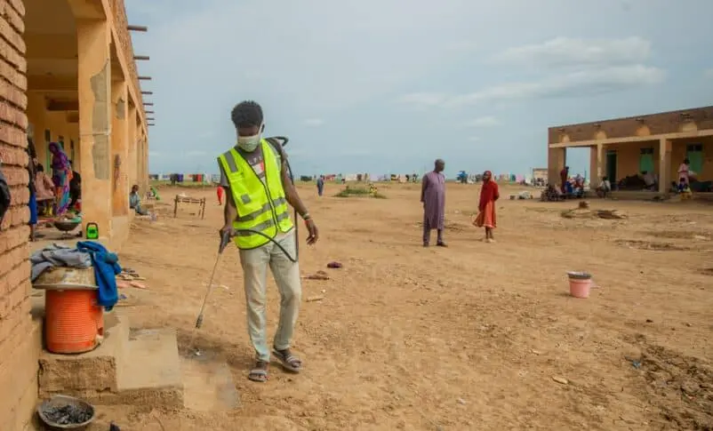 On 3 September 2024 a volunteer sprays the compound and spaces at Alashpal gathering point for displaced persons in West Kassala locality 802x485 1