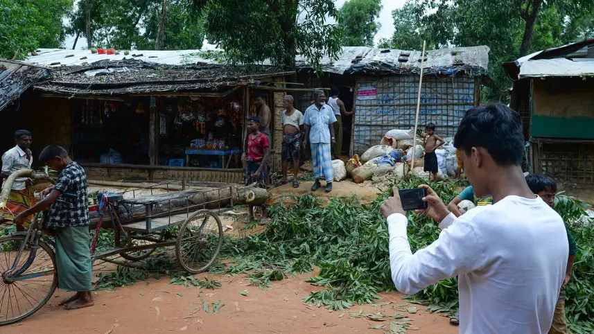 Rohingya youth taking photos 1