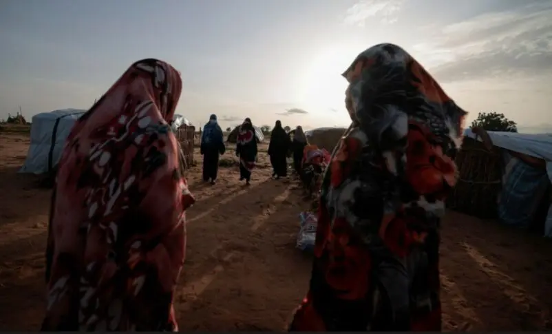 Survivors of sexual violence from the conflict in Geneina gather outside makeshift shelters in Adre Chad. Reuters file photo 802x485 1