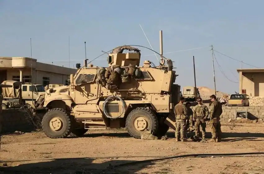 US Army soldiers stand outside their armored vehicle on a joint base with Iraqi army south of Mosul Iraq.Photo Khalid MohammedAP 850x560 1